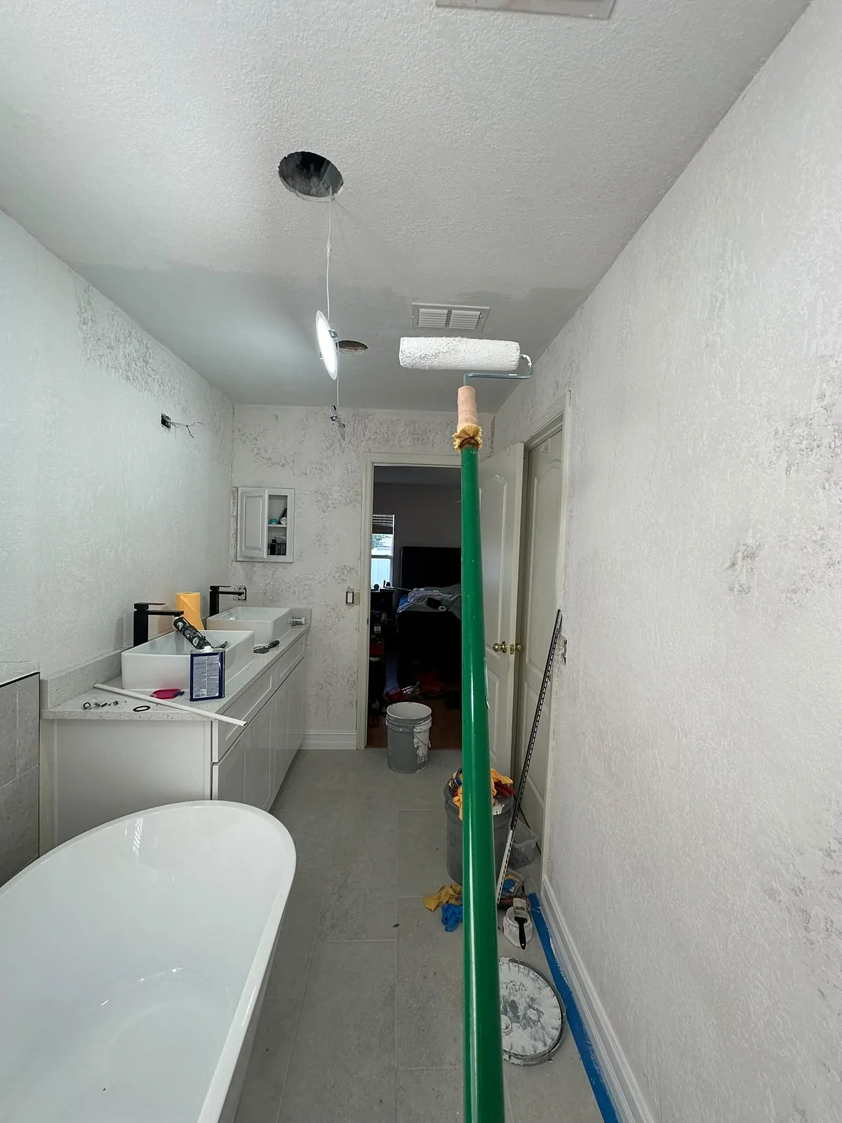 Bathroom walls being painted during a full bathroom remodel
