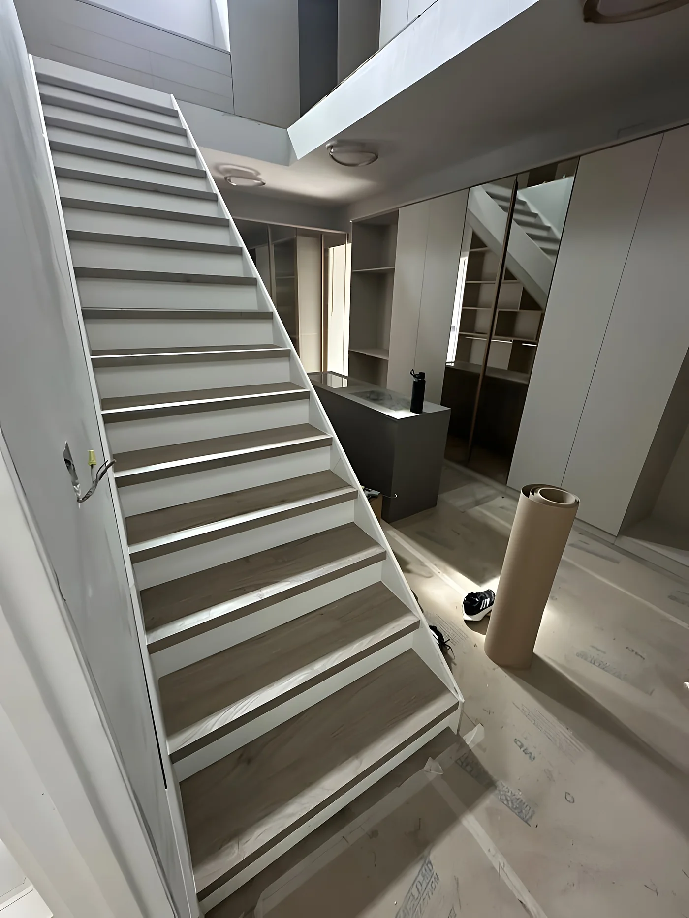 Floor protection paper covering the floor during a staircase renovation